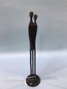 A modern abstract bronze of two figures, 42cm height