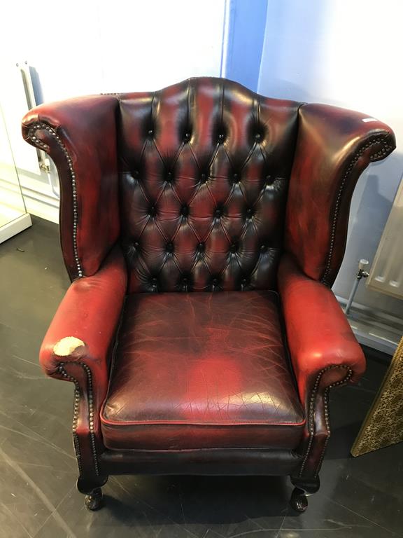 An oxblood leather Chesterfield high back armchair