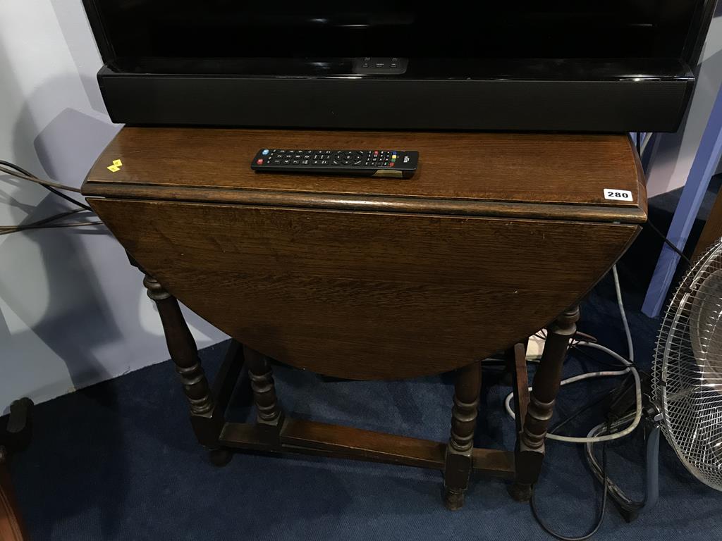 An oak gateleg table