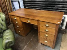 An oak pedestal desk