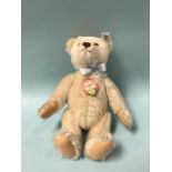 A Steiff replica 1953 Teddy Bear, with white tag, number 408489, white mohair and chest tag, 25cm