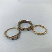 A 9ct gold sapphire and diamond full eternity ring, a 9ct gold wedding band, and a diamond and