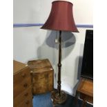A walnut pot cupboard and a standard lamp