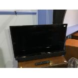 A Bush wall mounted TV, with remote