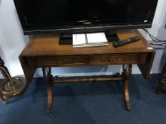 A reproduction mahogany leather inset sofa table