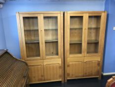 A pair of oak display cabinets
