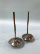 A pair of Taper holders, stamped 'Kabwe silver'