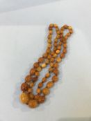 A string of amber coloured beads, 48g approx.