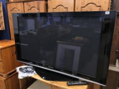 A Panasonic TV with remote