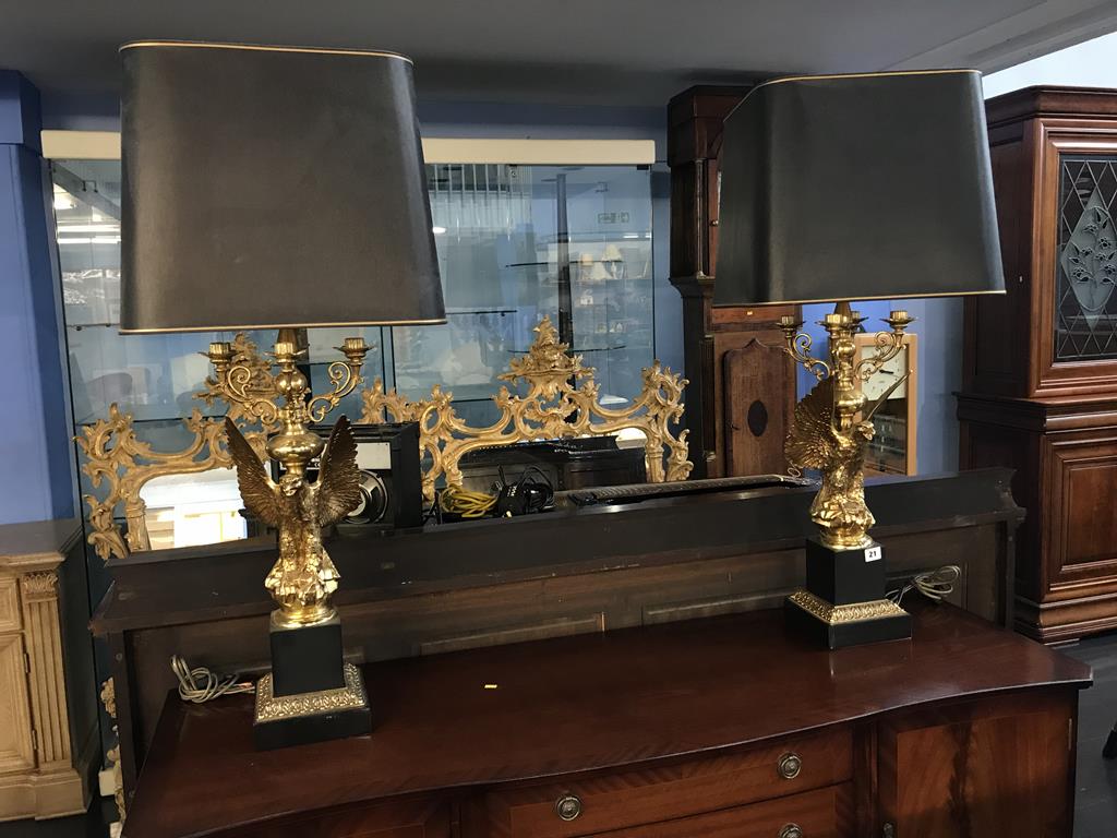 An impressive pair of Empire style gilt metal winged eagle table lamps, 94cm high