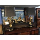 An impressive pair of Empire style gilt metal winged eagle table lamps, 94cm high
