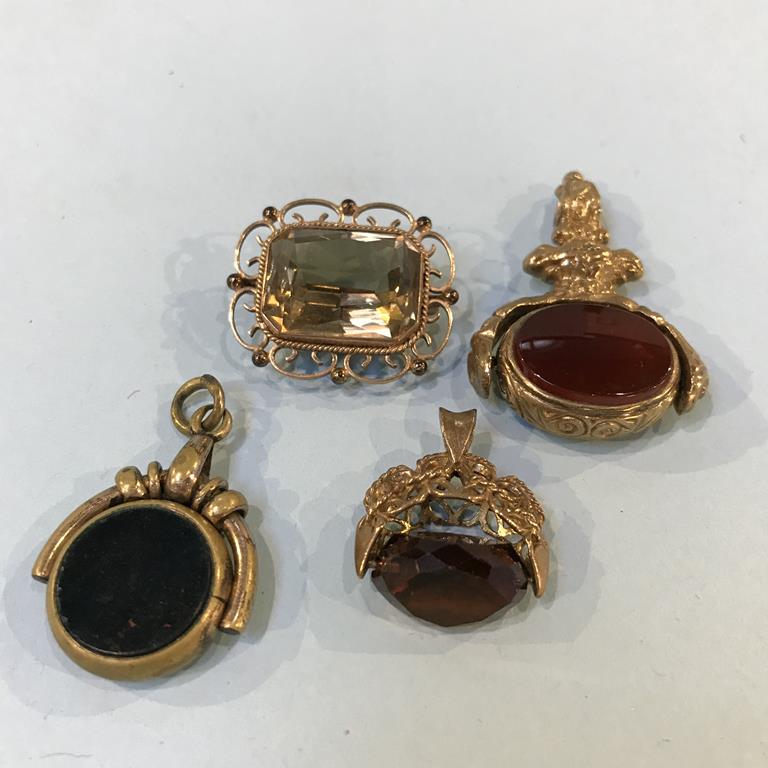 Two 9ct gold mounted fobs and a 9ct gold mounted brooch etc.