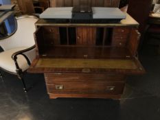 A reproduction mahogany campaign style secretaire chest, with inset leather top, 92cm wide