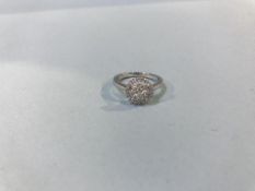 A 9ct gold diamond illusion style ring, 0.43ct