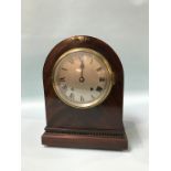 A mahogany mantel clock, with 8 day movement and strike action