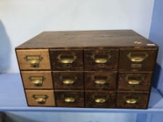 A set of twelve drawer office filing drawers, 67cm wide