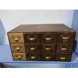 A set of twelve drawer office filing drawers, 67cm wide