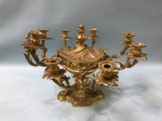 An impressive gilt metal Rococo style table centre piece, the central lidded dish surrounded by four