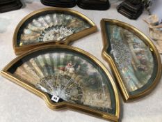 A set of three ornate cased fans, decorated in the romantic taste, 57cm wide