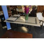 A marble top dining /garden table with metalware base, 138 x 79cm