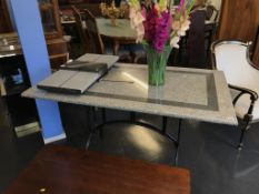 A marble top dining /garden table with metalware base, 138 x 79cm