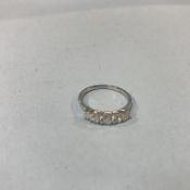 An 18ct white gold and diamond five stone ring, approximately 0.65ct