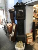 A carved oak long case clock and spares