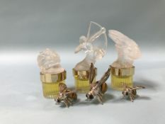 Three silver enamelled bees and three bottles of Lalique perfume