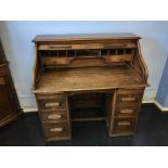 A 1930's oak tambour fronted desk