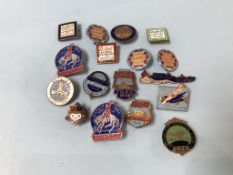 A collection of seventeen enamel badges, to include Butlins etc.