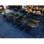 A set of four chrome and black leather chairs