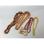 A collection of various amber coloured beads etc.