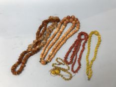 A collection of various amber coloured beads etc.