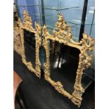 An impressive pair of Chippendale style ornate wall mirrors, 144 x 100cm