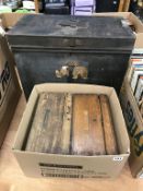 A tin trunk and two wooden boxes