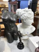 A model of a torso, a bust and a model of Spirit of Ecstasy