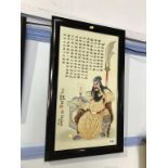 A framed Chinese porcelain plaque of a seated warrior, 56 x 30cm