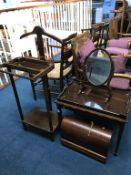 A valet stand, mirror and sewing machine etc.