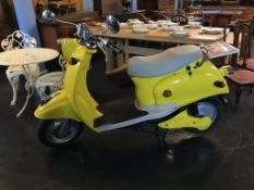 A yellow Chinese electric scooter, mileage (as shown), 00002, (no charger)