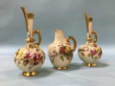 A pair of Worcester ewers and a flat back jug (3), 19cm height and 13cm height