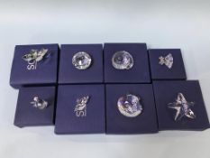 Eight various Swarovski glass items (boxed)