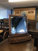 A 19th century mahogany bow front dressing table mirror, 58cm wide