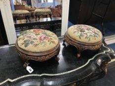 A pair of Victorian walnut footstools, 28cm diameter