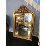A gilt over mantle mirror