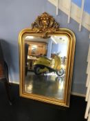 A gilt over mantle mirror