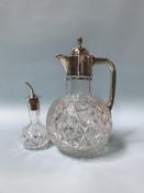 A silver mounted decanter and oil bottle