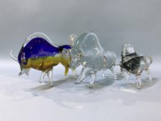 Three various glass bulls