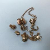 Various earrings, a carved pendant etc.