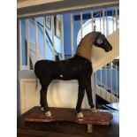 A Victorian carved wood and straw filled hobby horse, 74cm wide