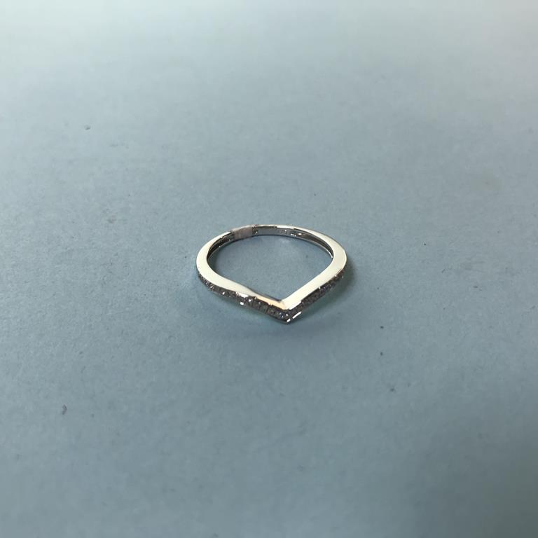 A 9ct white gold half diamond wishbone ring